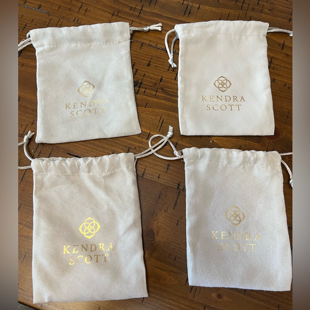 Four Kendra Scott jewelry bags
